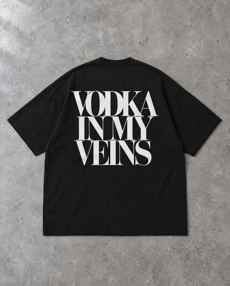 VODKA IN MY VEINS — Oversized Tee in Black, Rückenprint, Flat-Lay