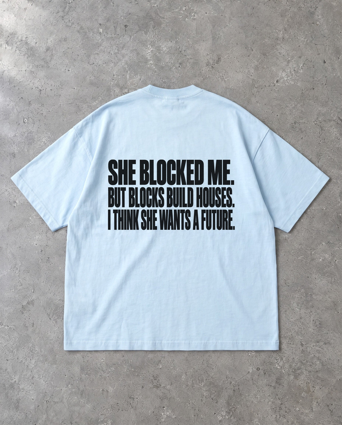 BLOCKS BUILD HOUSES — Oversized Tee in Baby Blue, Rückenprint, Flat-Lay