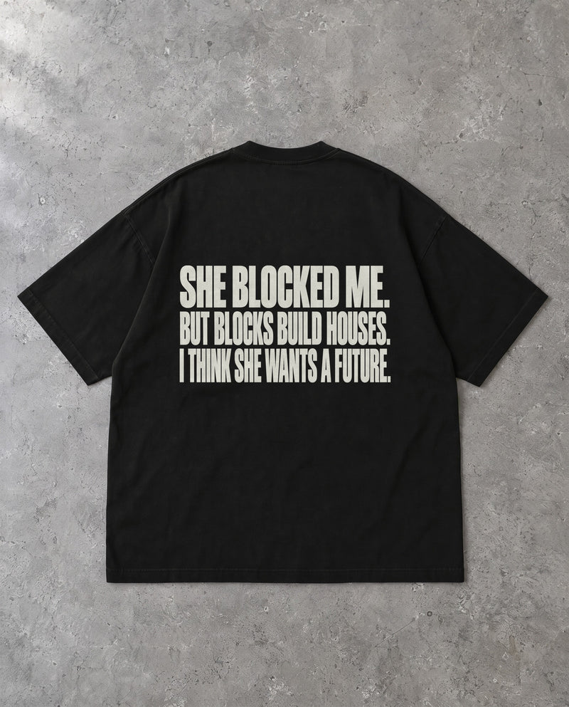 BLOCKS BUILD HOUSES — Oversized Tee in Black, Rückenprint, Flat-Lay