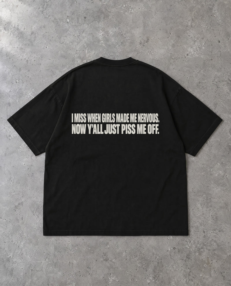 MADE ME NERVOUS — Oversized Tee in Black, Rückenprint, Flat-Lay
