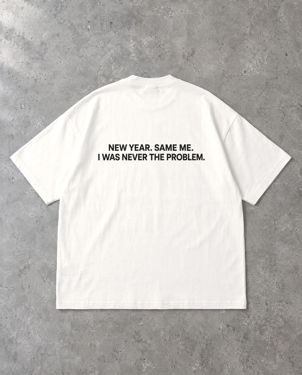 NEVER THE PROBLEM — Oversized Tee in White, Rückenprint, Flat-Lay