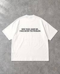 NEVER THE PROBLEM — Oversized Tee in White, Rückenprint, Flat-Lay