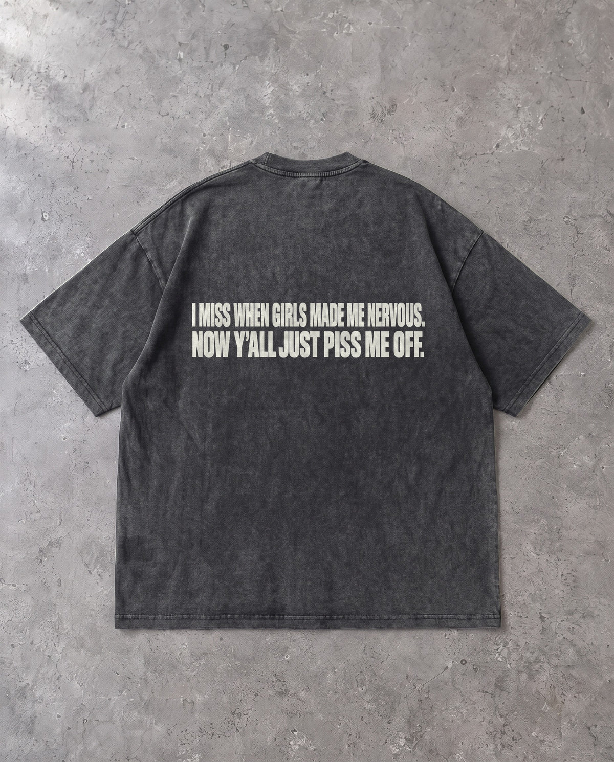 MADE ME NERVOUS — Oversized Tee in Washed Black, Rückenprint, Flat-Lay