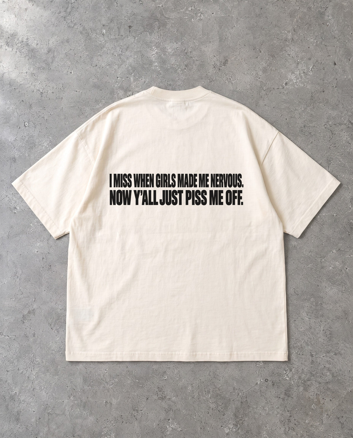 MADE ME NERVOUS — Oversized Tee in Natural Raw, Rückenprint, Flat-Lay