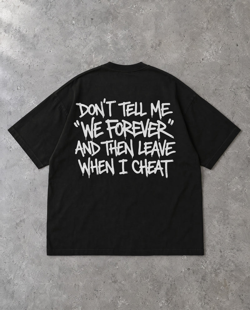 DON'T TELL ME — Oversized Tee in Black, Rückenprint, Flat-Lay